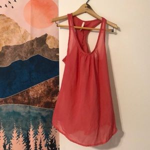 Cute sheer pink/salmon tank with ruffle on back racer back